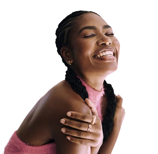 Woman smiling confidently with eyes closed, representing self-care and personal well-being
